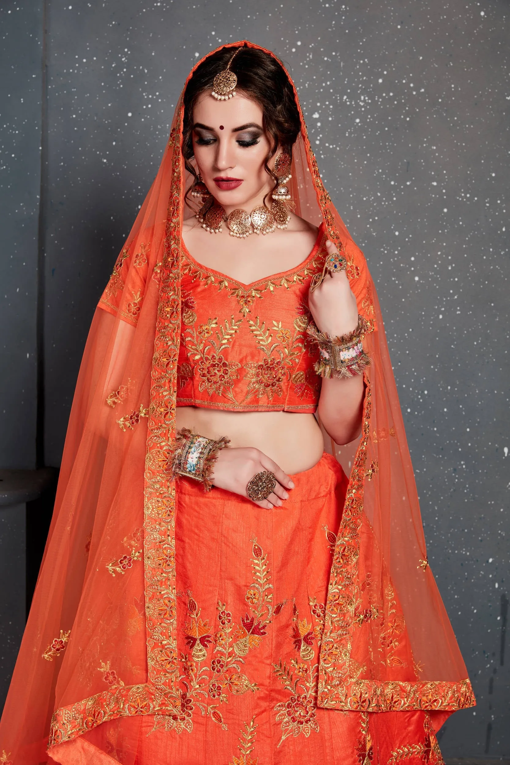 Hypnotic Orange Colored Slub Silk Lehenga Choli